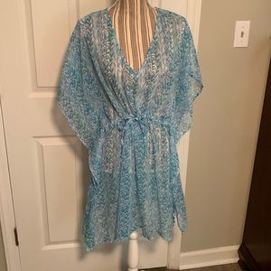 Cover up. Cute with drawstring waist. One size. Gently used.